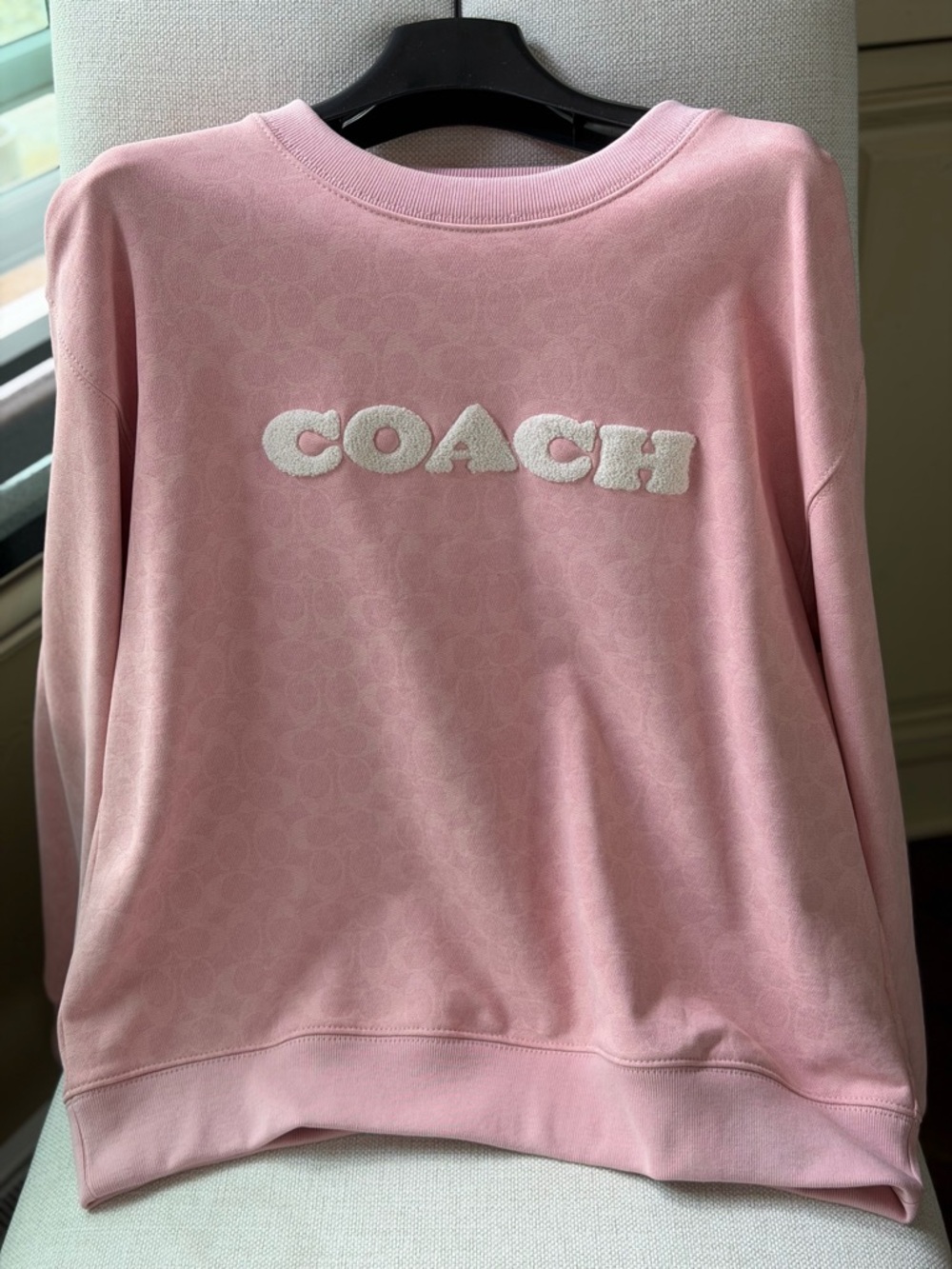 Signature pink COACH sweatshirt.  Brand new, never worn. Lovely!